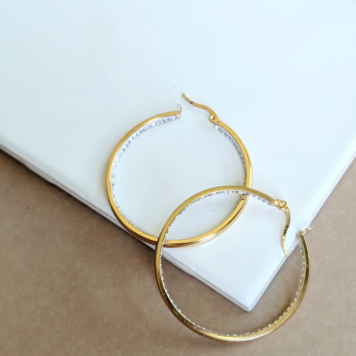 Gold crystal hoop earrings, rhinestone detail