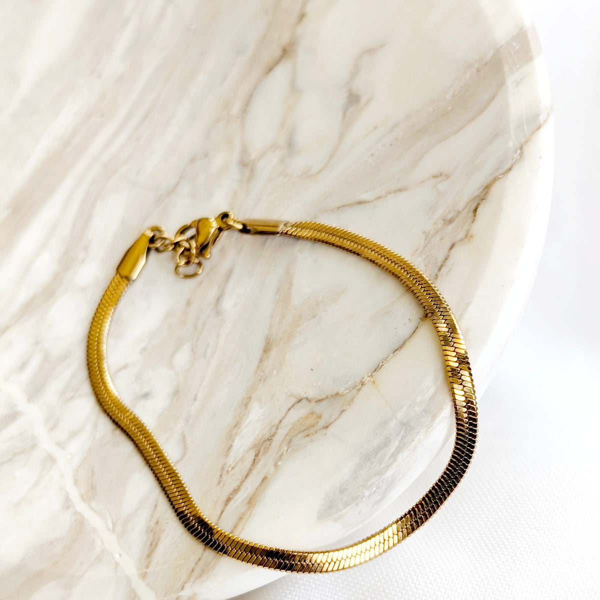 Gold herringbone chain bracelet with extender