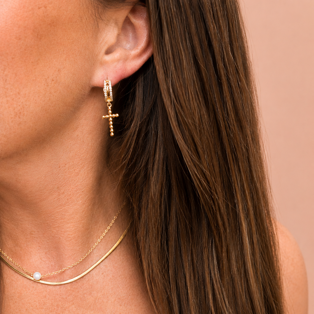 Demi gold pave cross dangle earrings